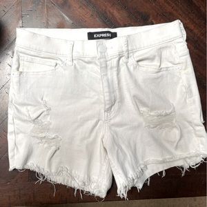 Express Women’s white Jean shorts, with rips for style. Size 10.